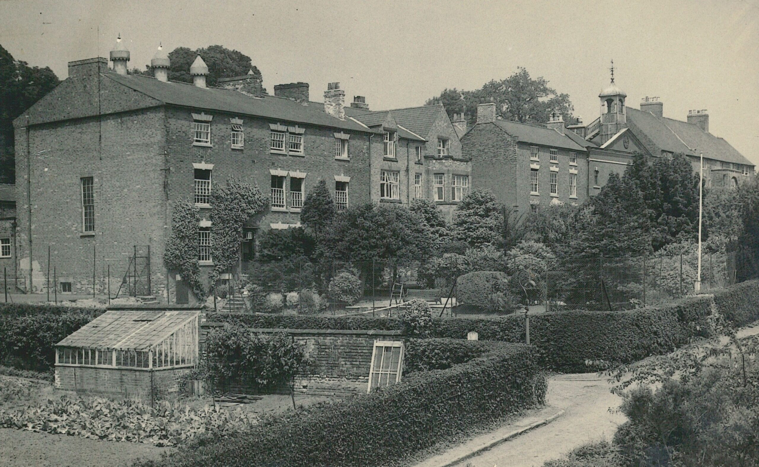 Black and white photo of an old school building at Ockbrook School